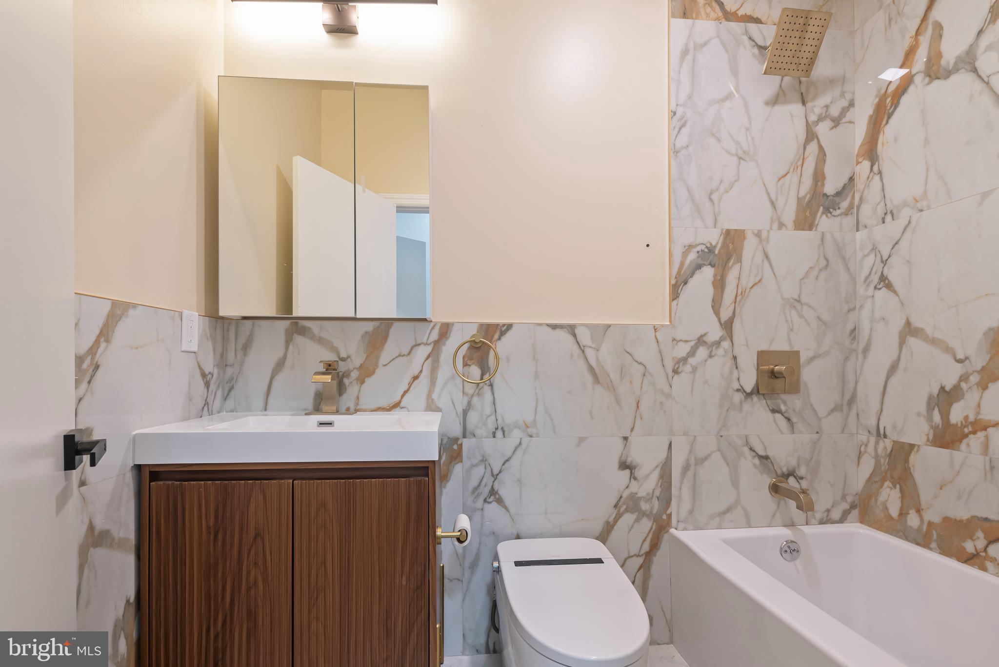 1618 South Broad Street Philadelphia, PA 19145 - Photo 7 of 27 a bathroom with a sink toilet and shower