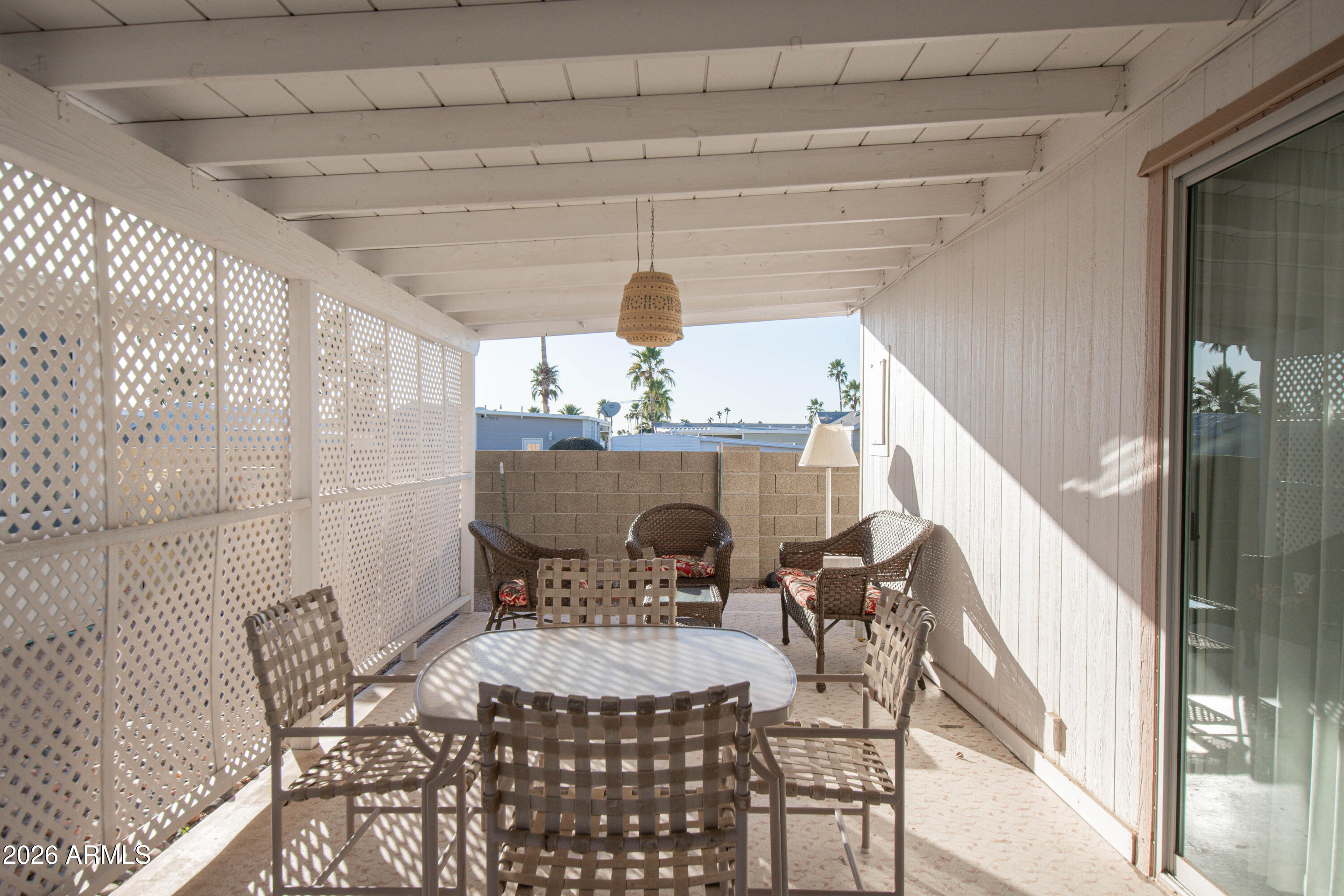 5735 East McDowell Road, Unit 26 Mesa, AZ 85215 - Photo 26 of 39 a view of a dining room with furniture and wooden floor