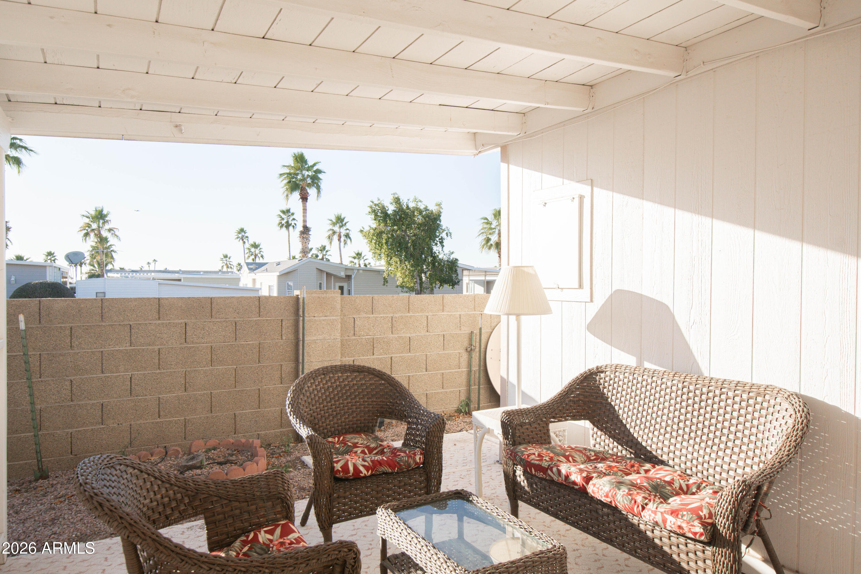 5735 East McDowell Road, Unit 26 Mesa, AZ 85215 - Photo 27 of 39 a living room with furniture and a floor to ceiling window