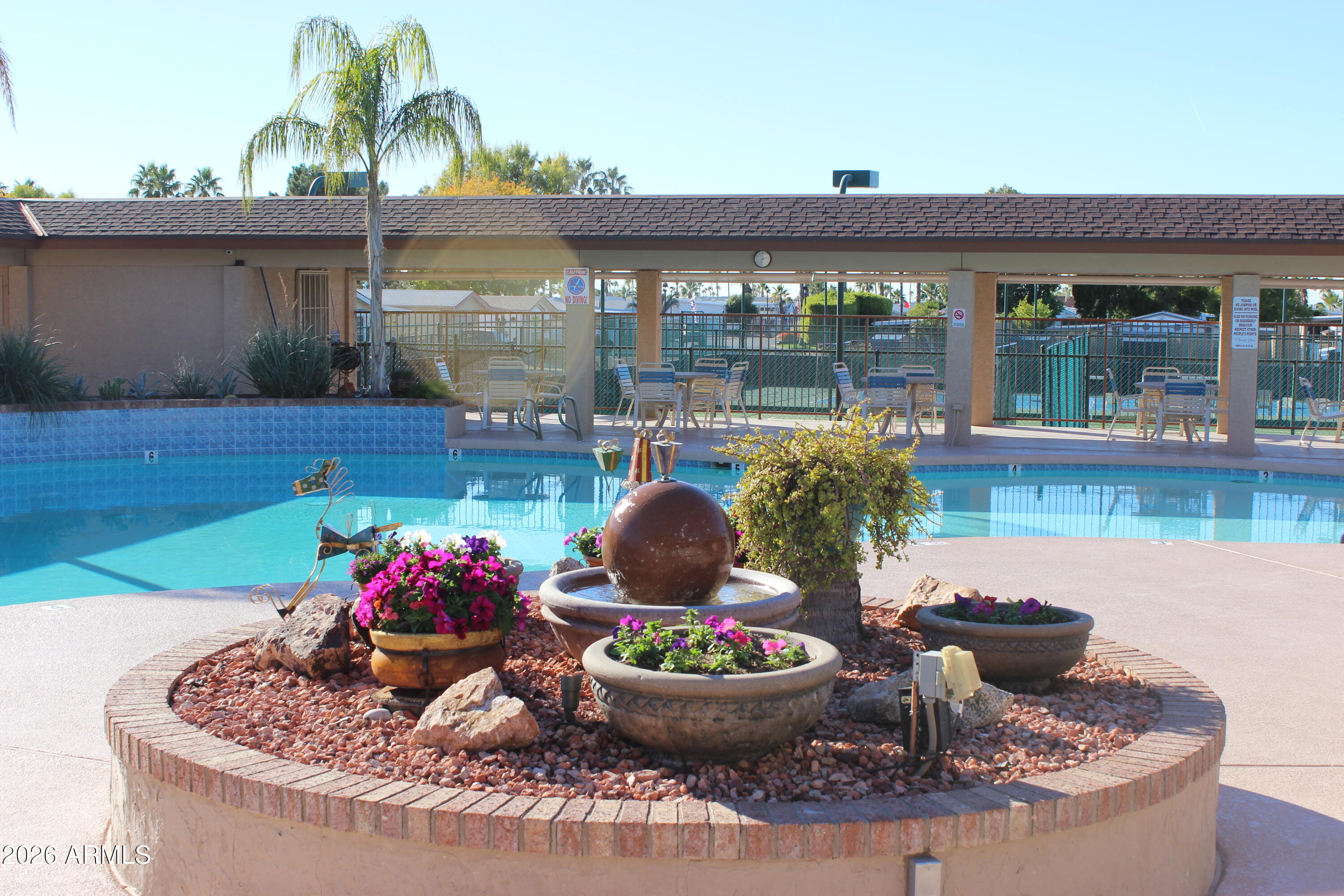 5735 East McDowell Road, Unit 26 Mesa, AZ 85215 - Photo 36 of 39 a living room with furniture and a potted plant