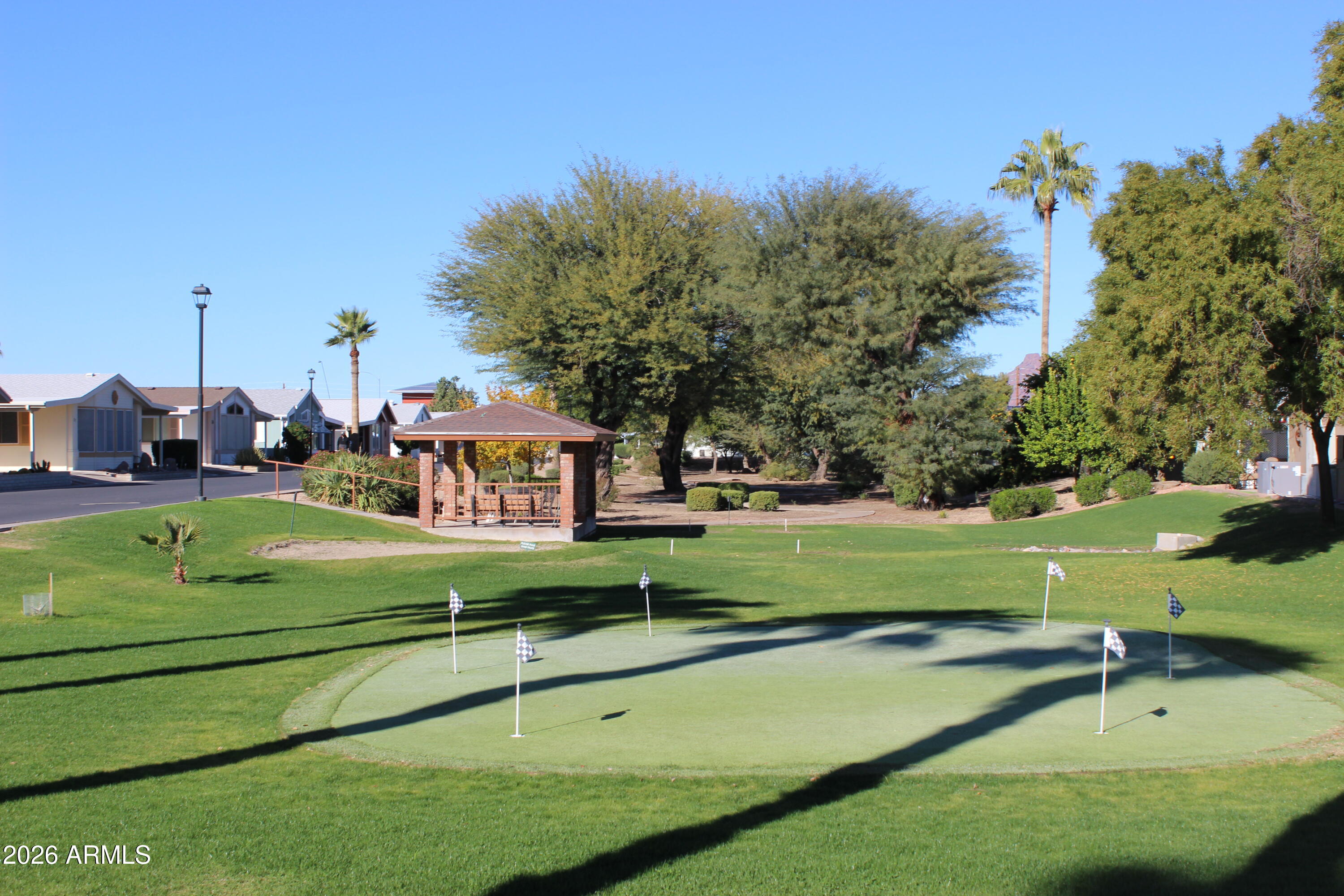 5735 East McDowell Road, Unit 26 Mesa, AZ 85215 - Photo 38 of 39 a view of a park with large trees