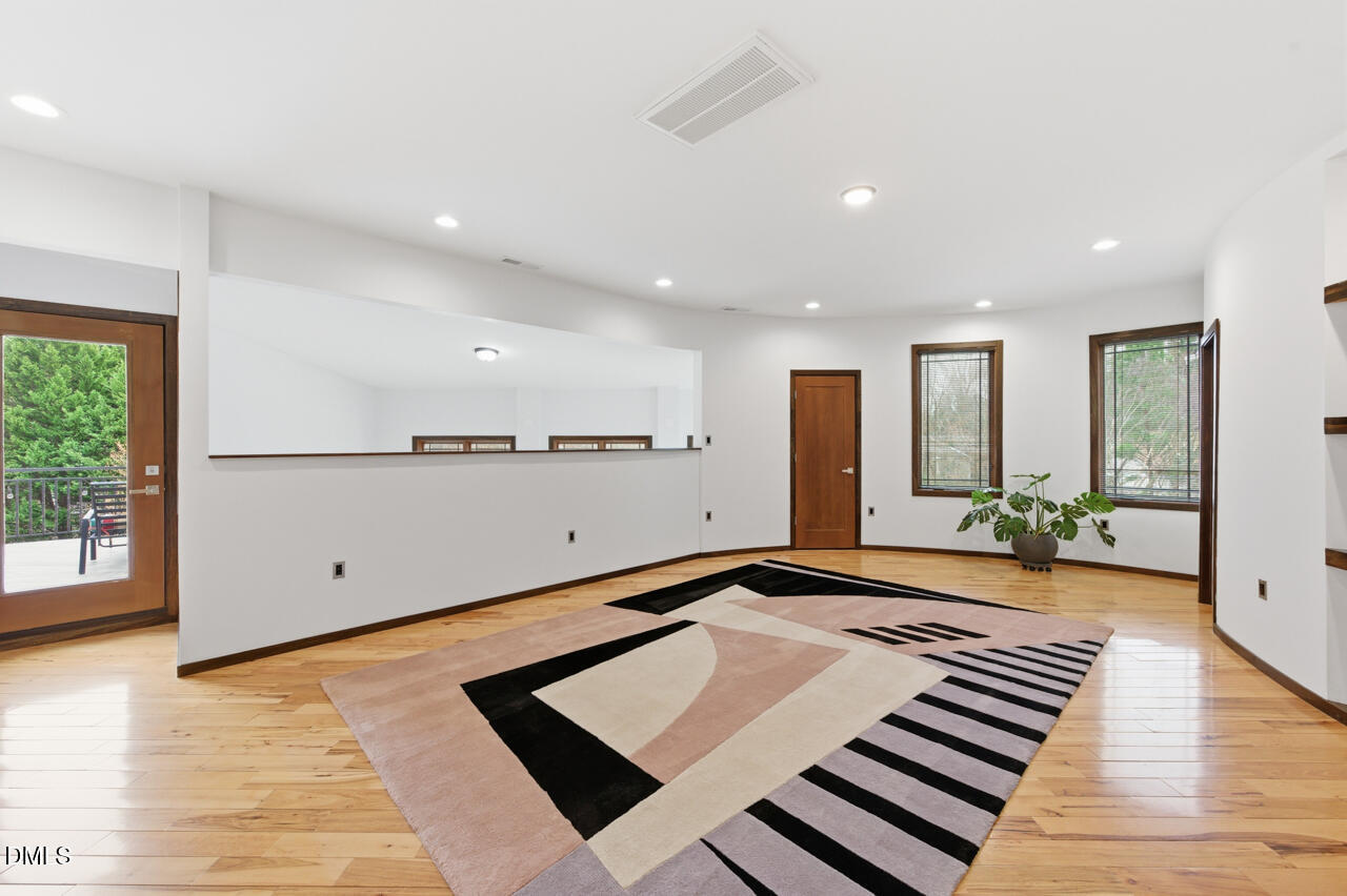 3315 Denada Path Durham, NC 27707 - Photo 27 of 74 a view of a room with wooden floor and windows