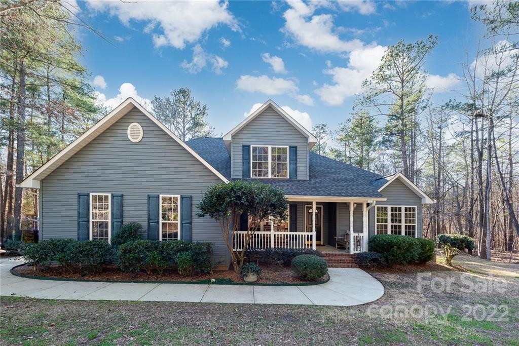 2389 Holbrook Road Fort Mill, SC 29715 - Photo 1 of 35 a front view of a house with garden
