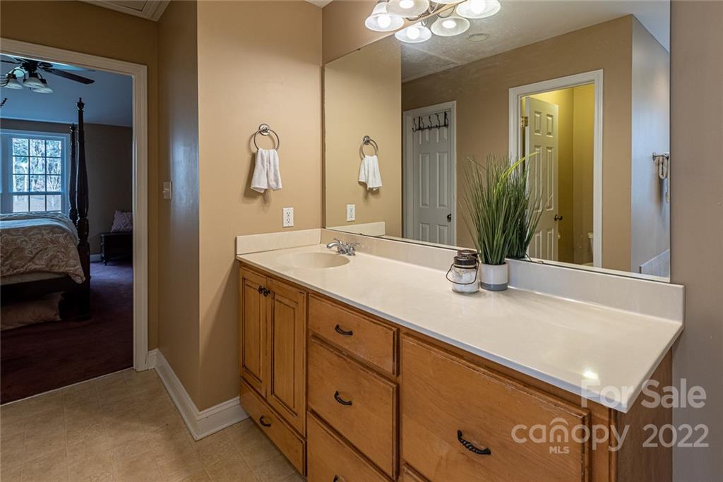 2389 Holbrook Road Fort Mill, SC 29715 - Photo 21 of 35 a bathroom with a sink and a mirror