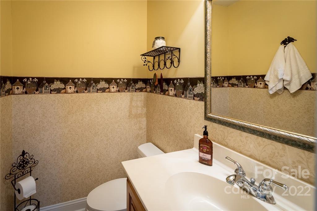 2389 Holbrook Road Fort Mill, SC 29715 - Photo 29 of 35 a bathroom with a sink and a mirror
