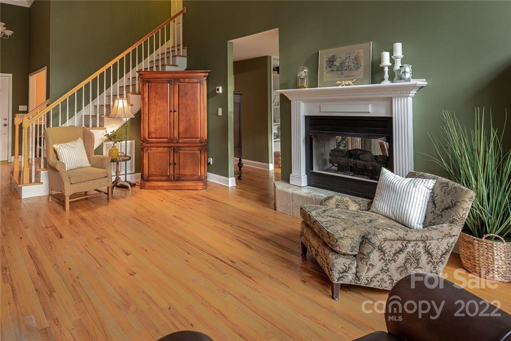 2389 Holbrook Road Fort Mill, SC 29715 - Photo 7 of 35 a living room with furniture and a fireplace
