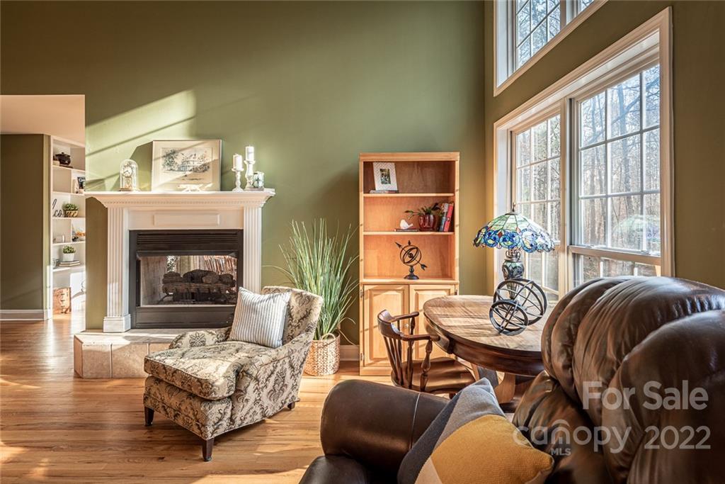 2389 Holbrook Road Fort Mill, SC 29715 - Photo 8 of 35 a living room with furniture and a fireplace