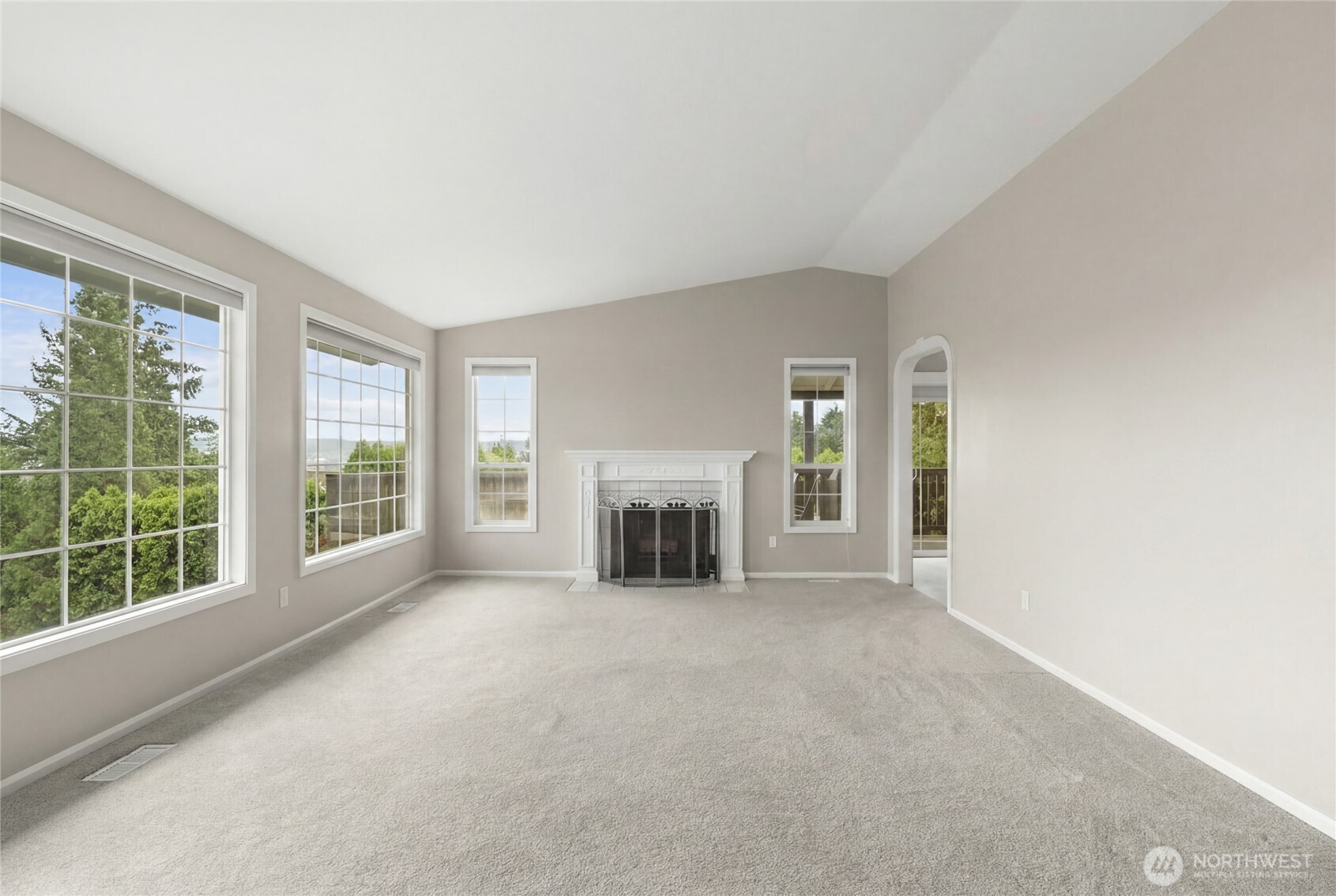 10 Jeffery Place Longview, WA 98632 - Photo 14 of 40 an empty room with floor to ceiling window and fireplace