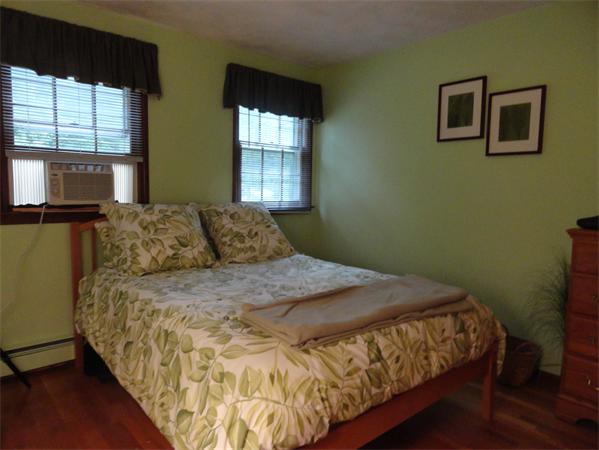 39 Barton Road Stow, MA 01775 - Photo 13 of 14 a bed sitting in a bedroom next to a window