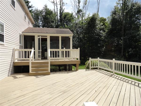 39 Barton Road Stow, MA 01775 - Photo 14 of 14 a view of a house with a deck