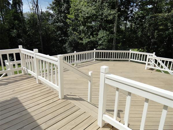 39 Barton Road Stow, MA 01775 - Photo 2 of 14 a view of a wooden deck with a large window
