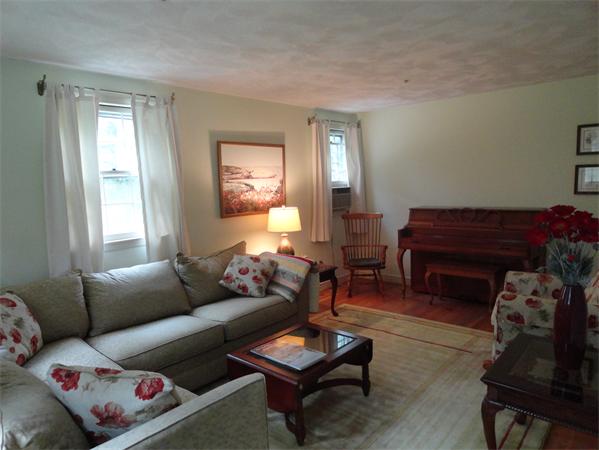 39 Barton Road Stow, MA 01775 - Photo 8 of 14 a living room with furniture and a potted plant