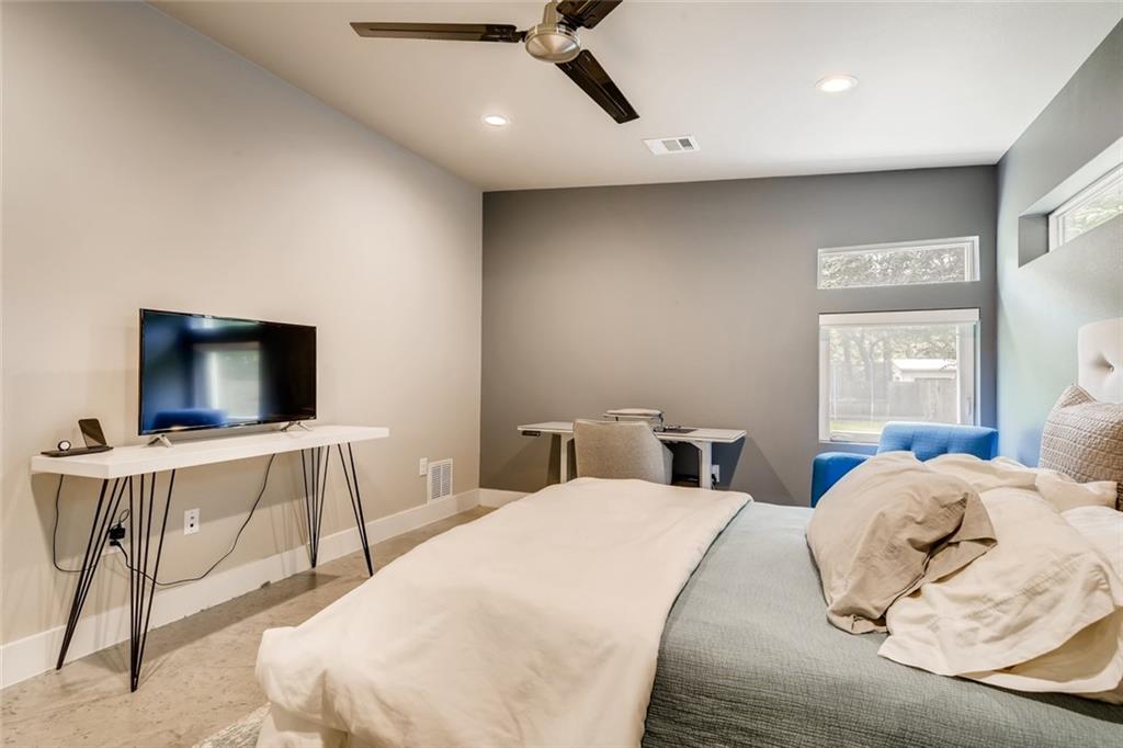 1142 Eleanor Street, Unit 2 Austin, TX 78721 - Photo 13 of 24 Well-lit sleeping quarters with a dedicated study area and large windows.
