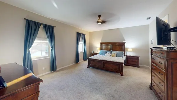 a view of a dining room with furniture and window