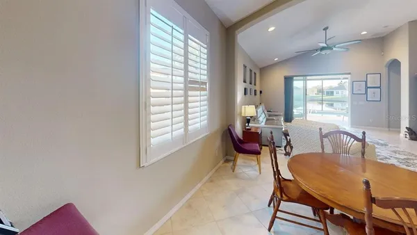 a bedroom with a bed and a television