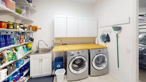 a bathroom with a sink a toilet a mirror and shower curtain