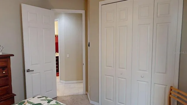 a work room with furniture and a book shelf