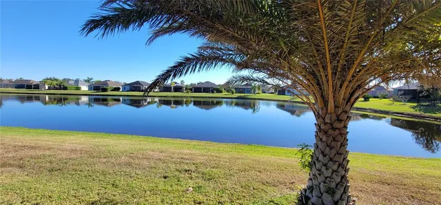 a kitchen with granite countertop wooden cabinets and stainless steel appliances