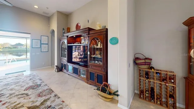 a view of a livingroom with furniture and a flat screen tv