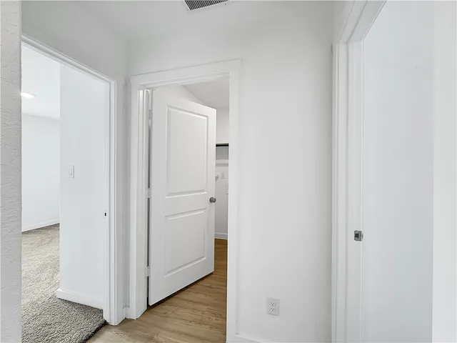 a view of a bathroom with wooden floor