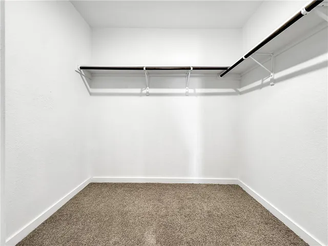 a view of cabinets with wooden floor