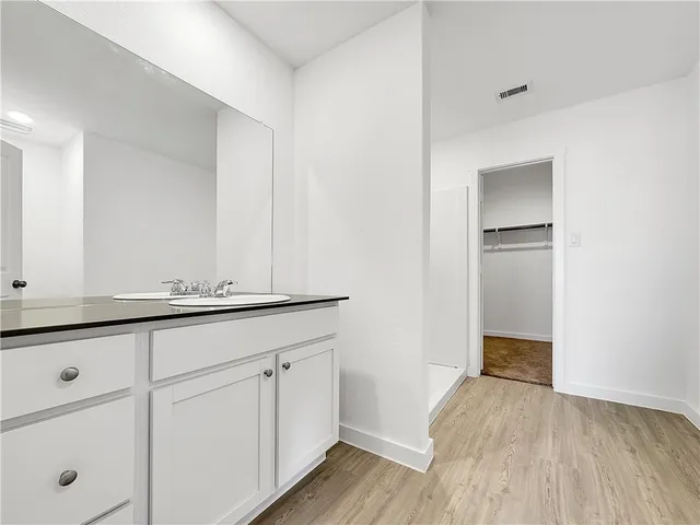 a bathroom with a tub and shower
