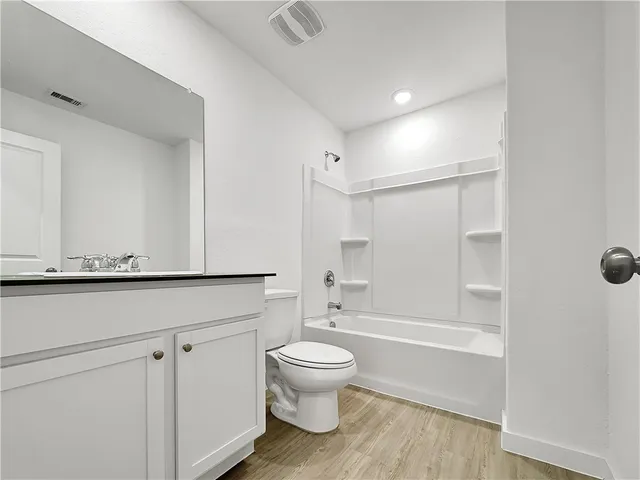 a view of a garage with walk in closet