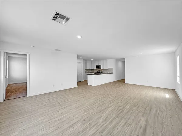 a view of kitchen with wooden floor