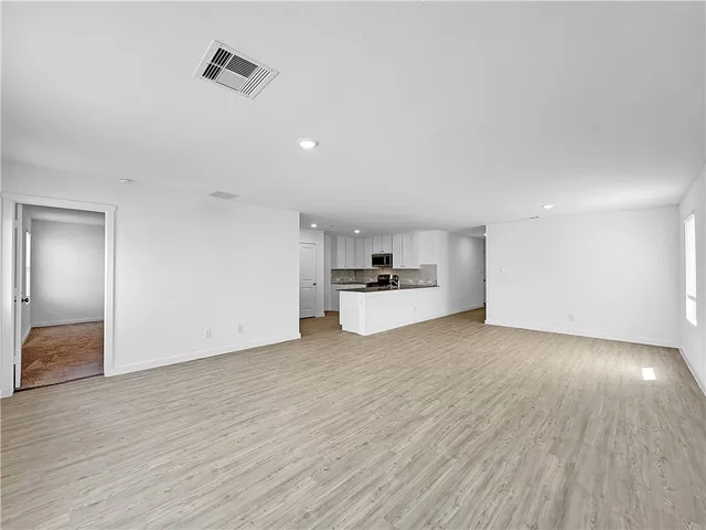 a view of kitchen with wooden floor