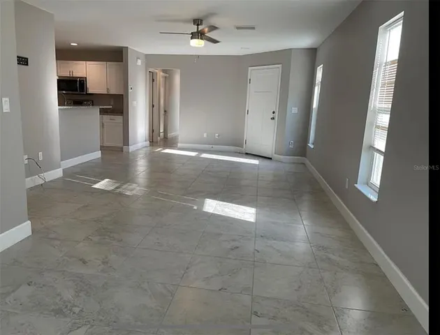 a view of a storage & utility room with a sink