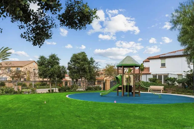 a view of a house with a backyard porch and sitting area