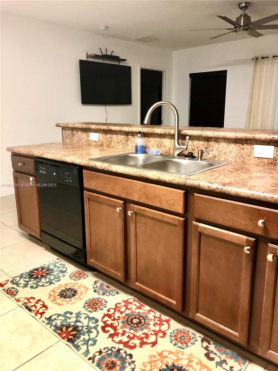 1018 Foster Road Hallandale Beach, FL 33009 - Photo 3 of 13 a kitchen with stainless steel appliances granite countertop sink stove and granite counter top
