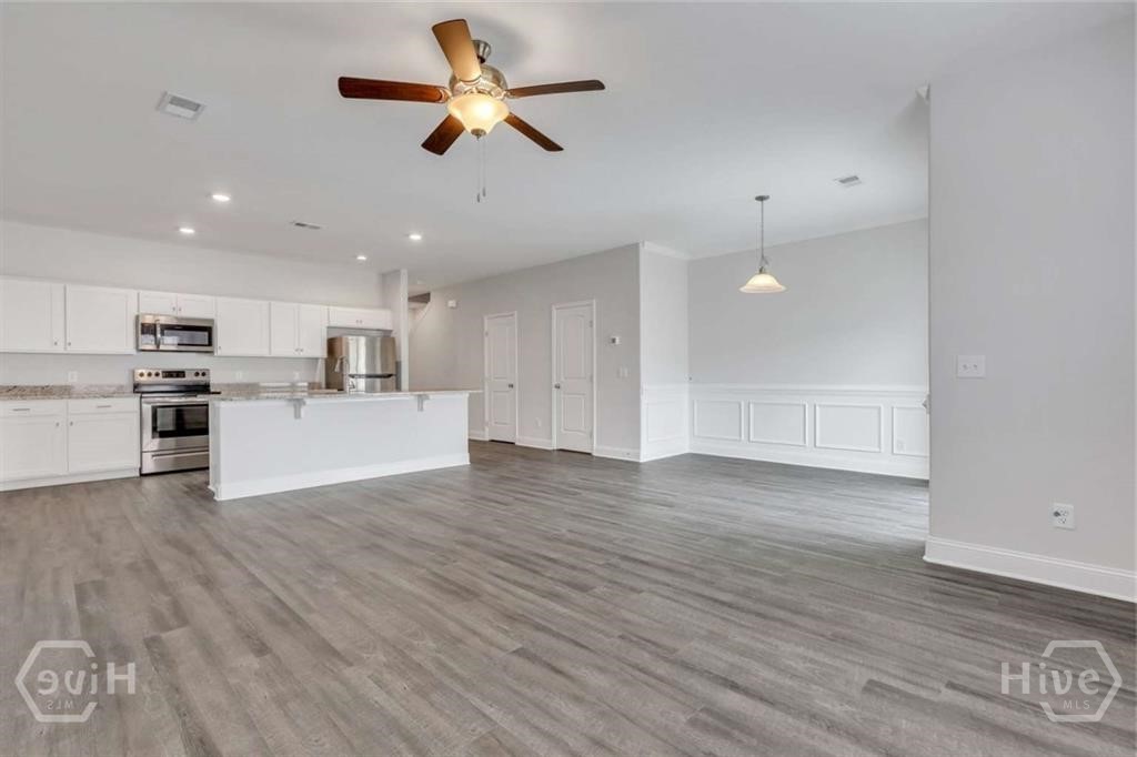 336 Gov Gwinnett Way Pooler, GA 31322 - Photo 2 of 20 Open & airy, sleek & modern. The doors at top right are for the big pantry and the convenient powder room.
