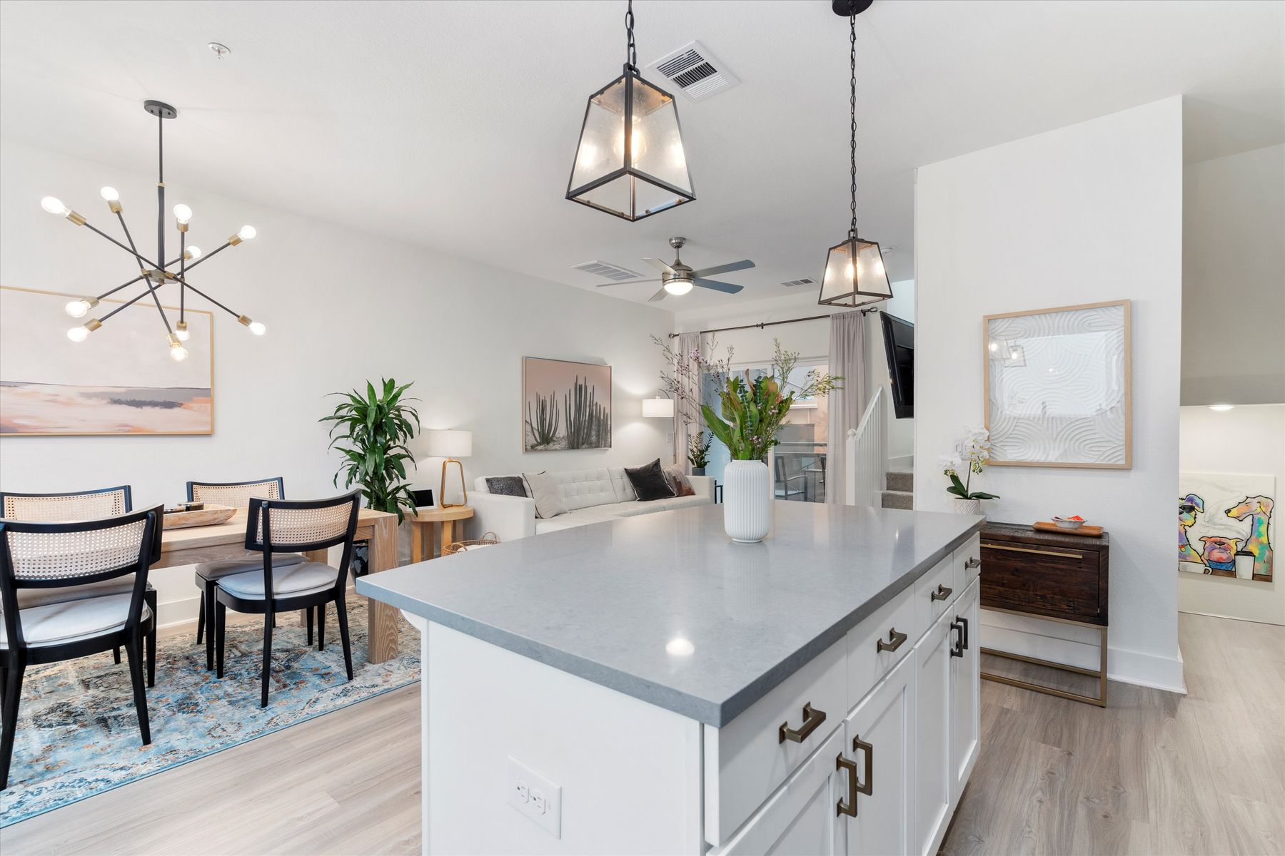 2827 Manor Road, Unit 3102 Austin, TX 78722 - Photo 6 of 18 An open-concept living space with a spacious kitchen island and elegant pendant lighting welcomes you home.