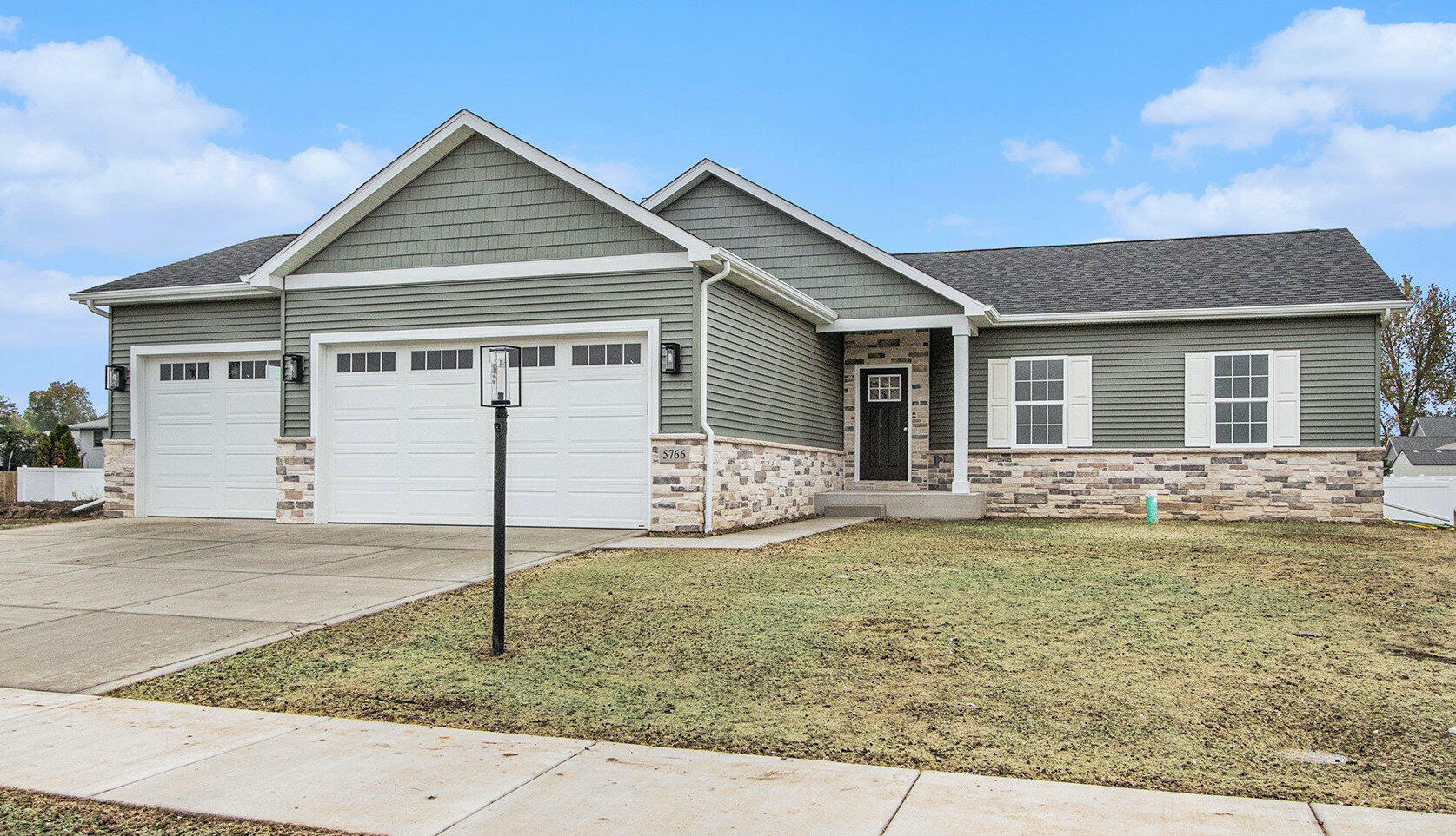 5766 Brookview Avenue Portage, IN 46368 - Photo 1 of 18 a front view of a house with a yard