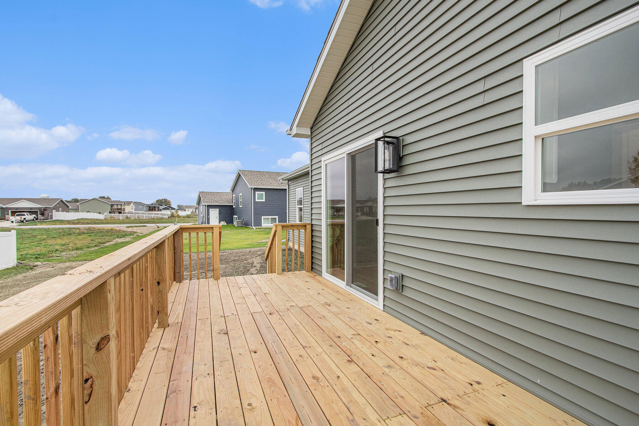 5766 Brookview Avenue Portage, IN 46368 - Photo 16 of 18 a view of a balcony with wooden floor and fence
