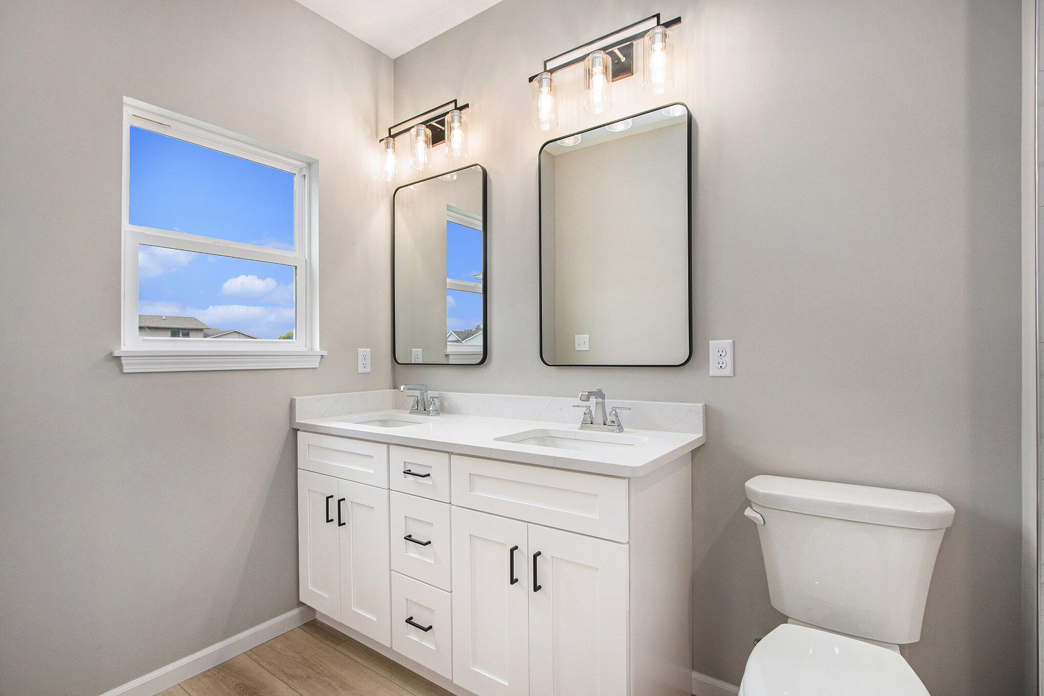 5766 Brookview Avenue Portage, IN 46368 - Photo 10 of 18 a bathroom with 2 toilet sink and mirror