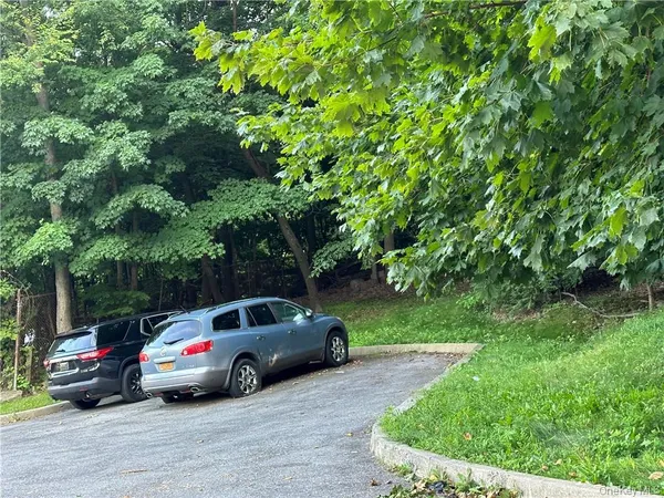 a view of street with parked cars