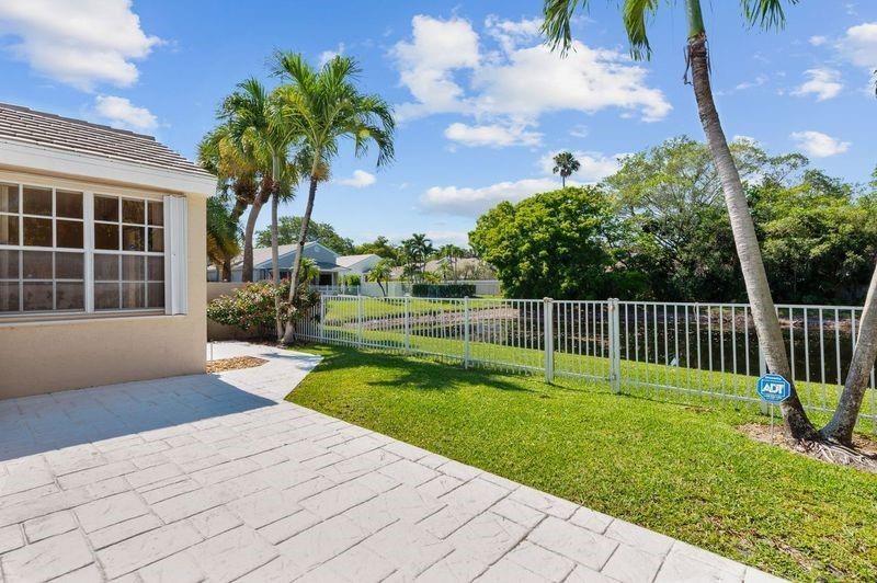 8170 Hampton Wood Drive Boca Raton, FL 33433 - Photo 18 of 21 a house with garden in front of it
