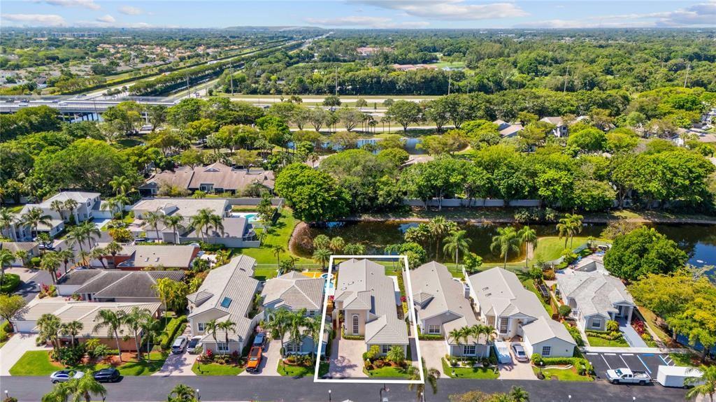 8170 Hampton Wood Drive Boca Raton, FL 33433 - Photo 20 of 21 an aerial view of residential houses with outdoor space and lake view