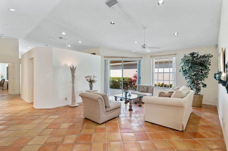 8170 Hampton Wood Drive Boca Raton, FL 33433 - Photo 3 of 21 a living room with furniture and a large window