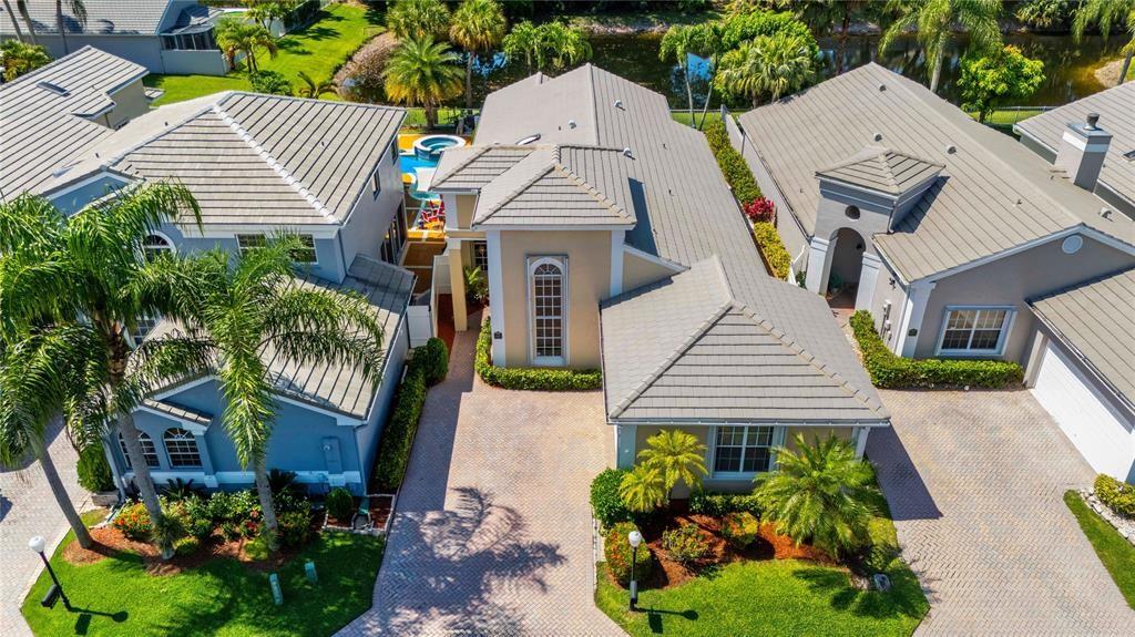 8170 Hampton Wood Drive Boca Raton, FL 33433 - Photo 5 of 21 an aerial view of a house with a yard and potted plants