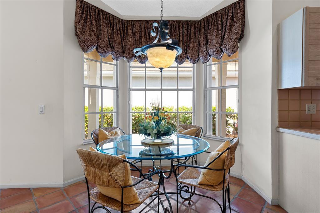 8170 Hampton Wood Drive Boca Raton, FL 33433 - Photo 9 of 21 a dining room with furniture and window