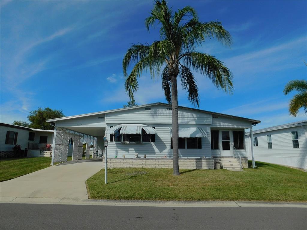 4312 14th Street East Ellenton, FL 34222 - Photo 1 of 1 a front view of house with a garden