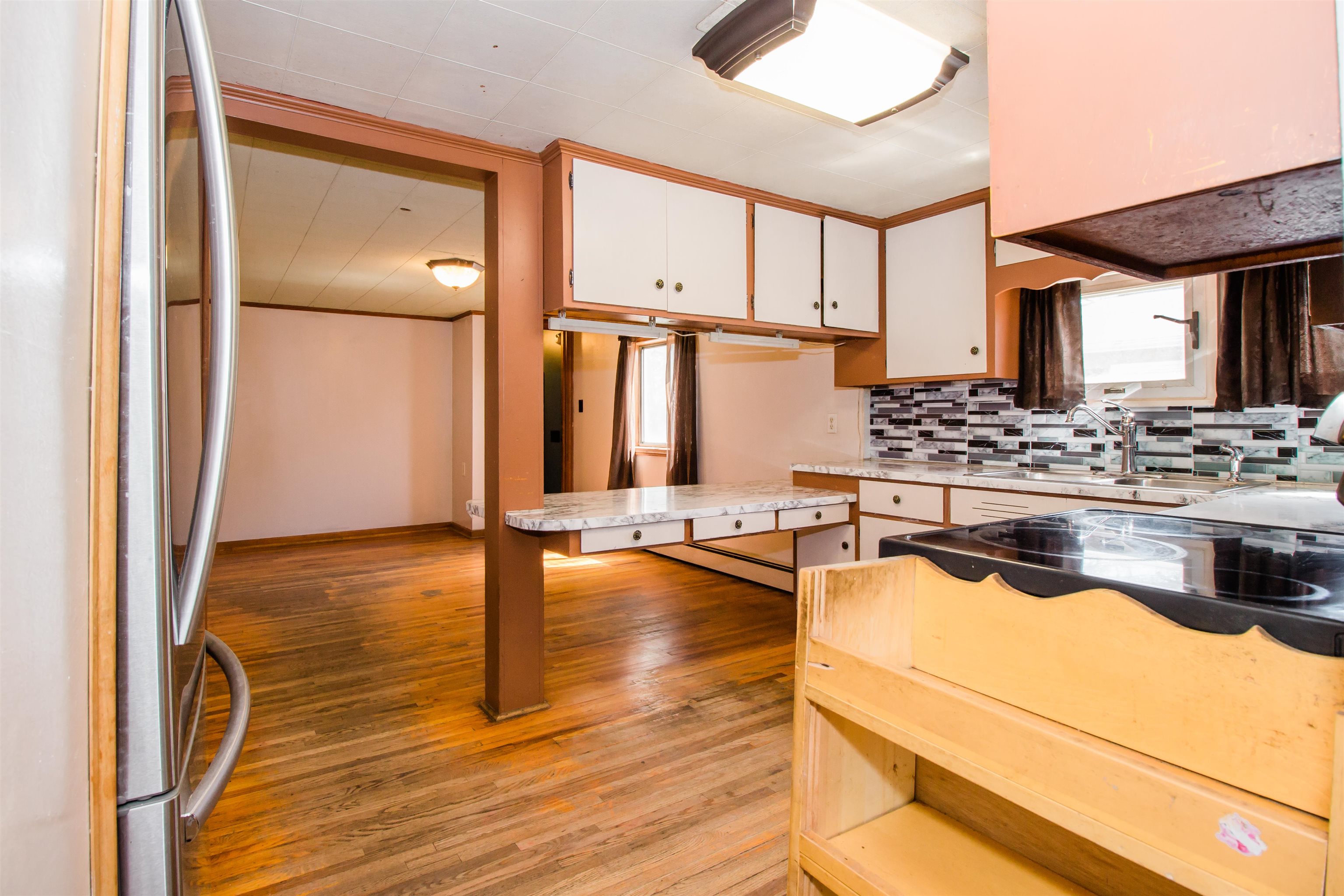 409 Bruce Street Bridgewater, VA 22812 - Photo 13 of 29 a view of living room with furniture and floor to ceiling window