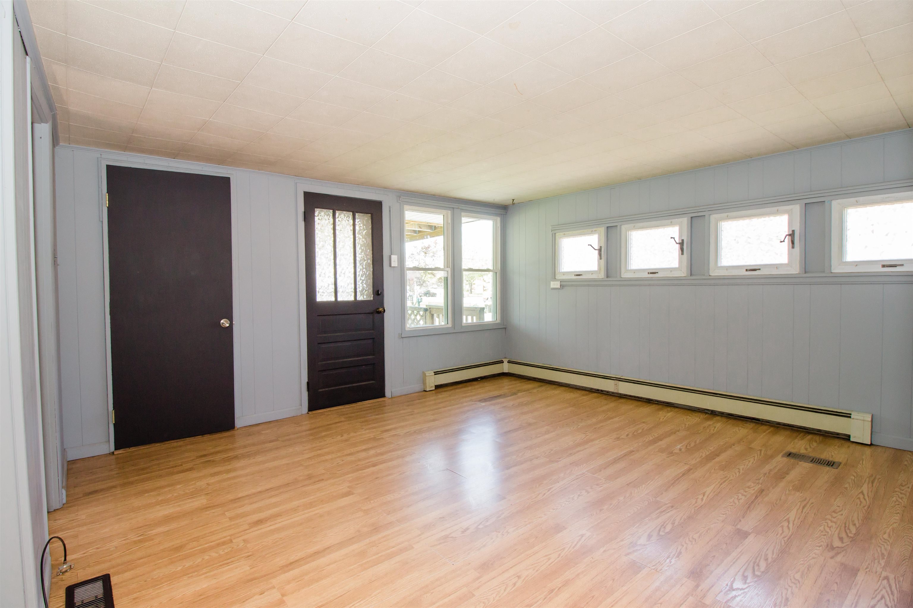 409 Bruce Street Bridgewater, VA 22812 - Photo 8 of 29 a view of an empty room with wooden floor and a window