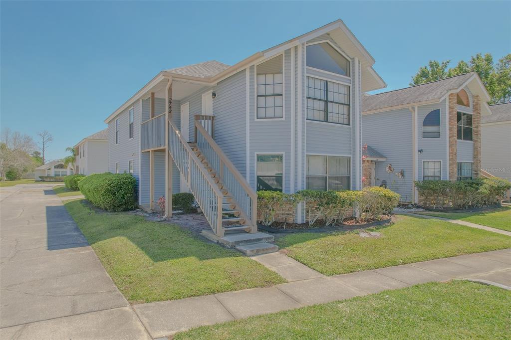 2742 Rio Grande Trail Kissimmee, FL 34741 - Photo 16 of 18 a front view of a house with a yard