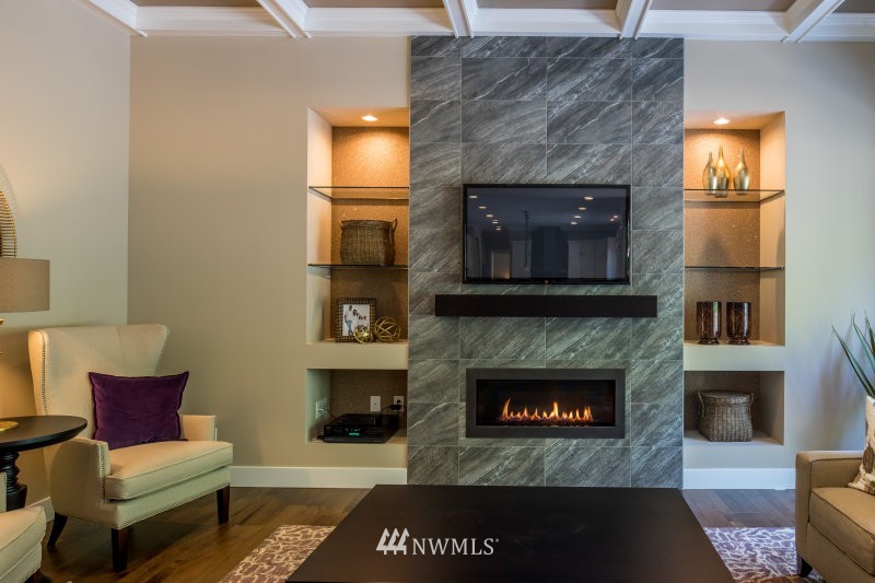 5629 196th Street Southeast, Unit 32 Bothell, WA 98012 - Photo 11 of 25 a living room with furniture and a fireplace