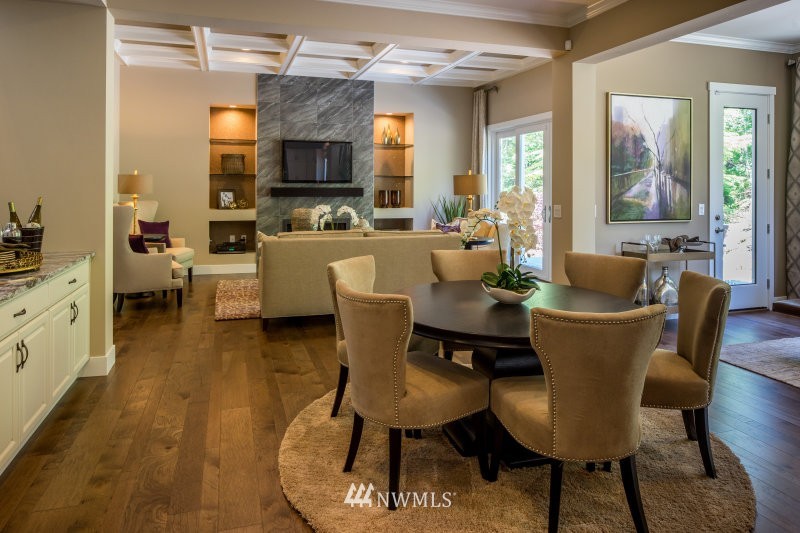 5629 196th Street Southeast, Unit 32 Bothell, WA 98012 - Photo 14 of 25 a dining room with furniture a window and wooden floor