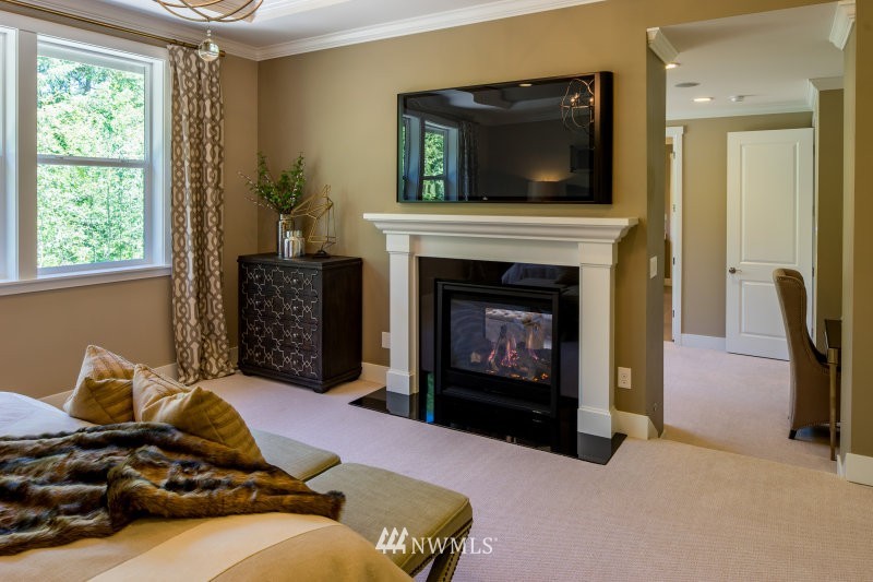5629 196th Street Southeast, Unit 32 Bothell, WA 98012 - Photo 21 of 25 a living room with furniture and a fireplace